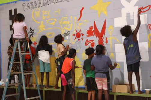 Photo of children painting provided by Community First Development